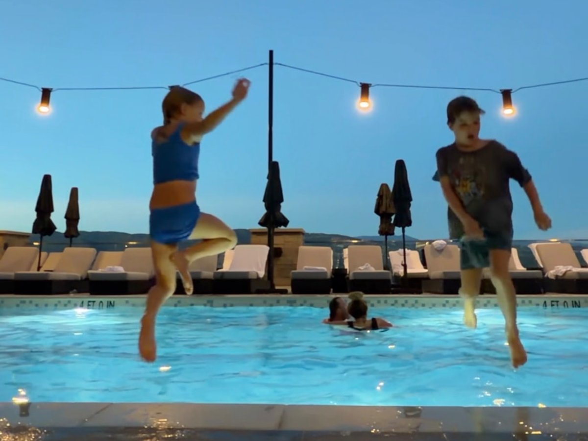 My kids jumping into the pool at the Grand Hyatt Deer Valley